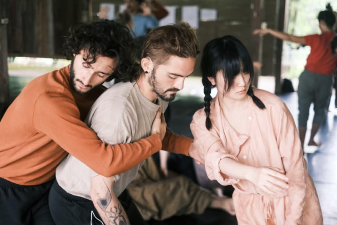 Three people researching through a Contact Improvisation sequence